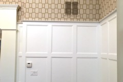 Custom Built in Place Wainscoting , Spray Finished With Benjamin Moore Aura Satin Super White.  Phillip Jeffries Patterned Grasscloth above. Great Falls, VA